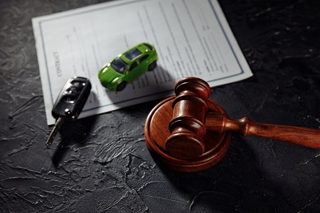 Car With Keys And Wooden Judge Gavel. Concept Of Selling A Car By Auction Or Accident Sentence